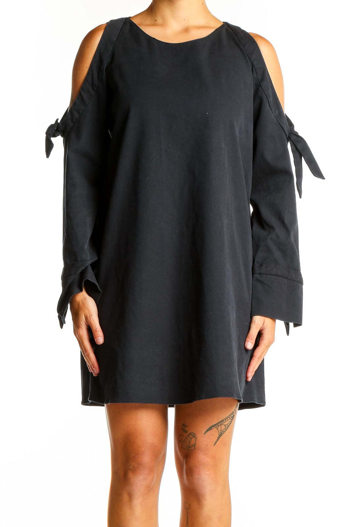 Front view of black Zara Trafaluc mini dress with cold shoulders and tie-sleeves