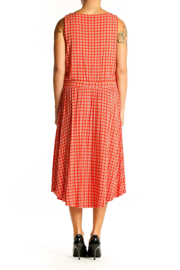 Side view of Maeve red geometric print midi dress showing dropped waist