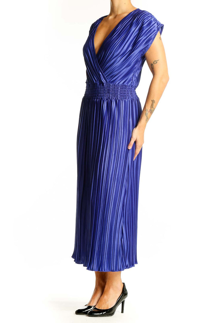 Front view of blue pleated DKNY midi dress with V-neck wrap bodice