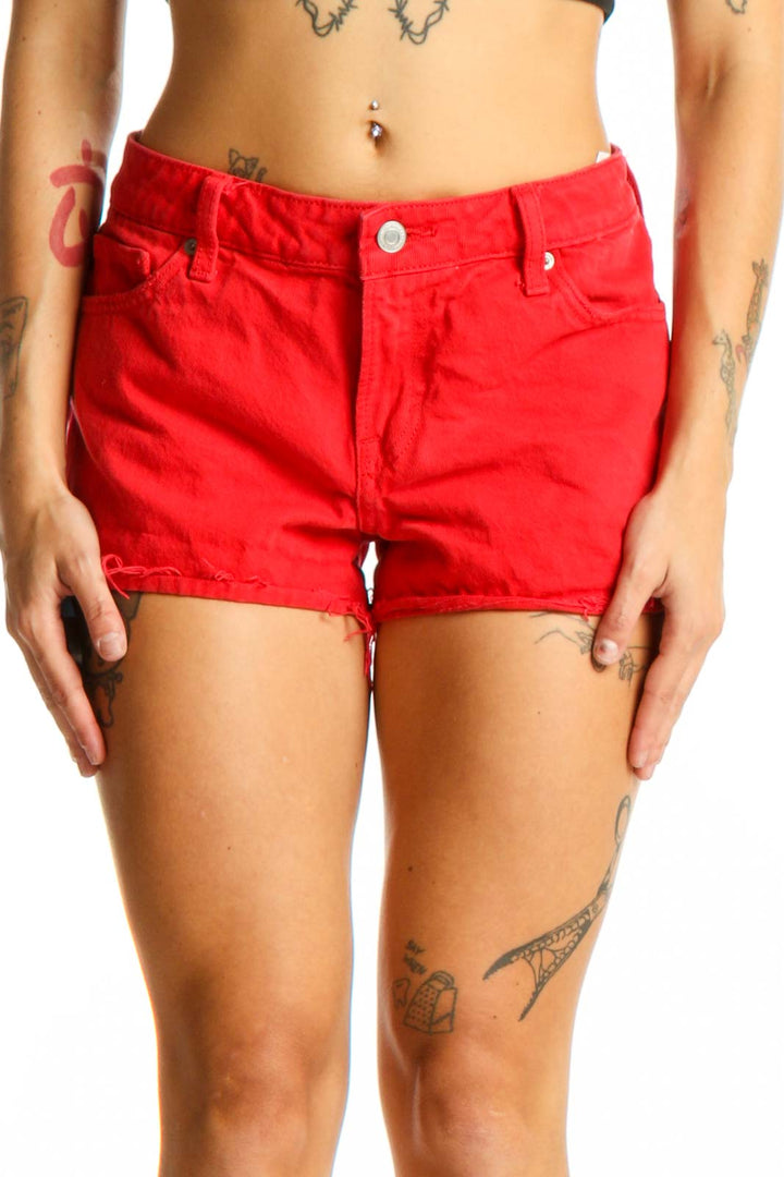 Front view of red Lucky Brand cotton shorts with frayed hem