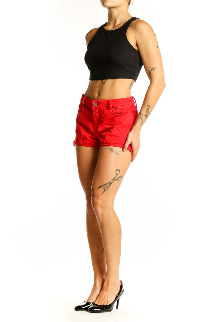 Front view of red Lucky Brand cotton shorts with frayed hem