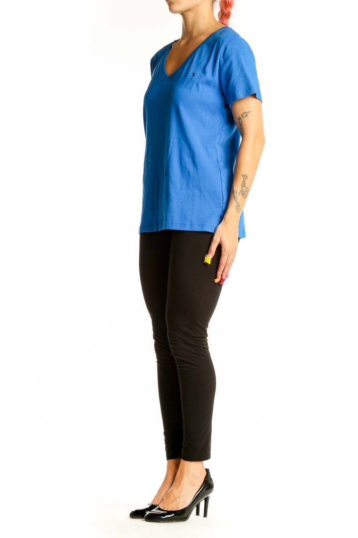 Front view of blue Tommy Hilfiger V-neck T-shirt on model