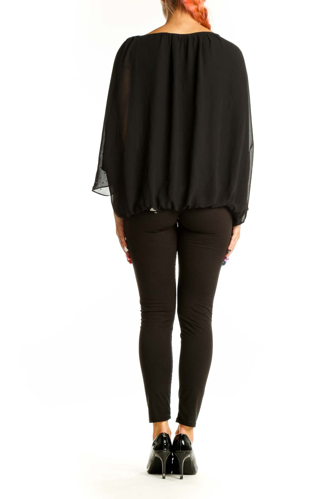 Side view of black SilkRoll blouse showing batwing sleeves and blouson bottom