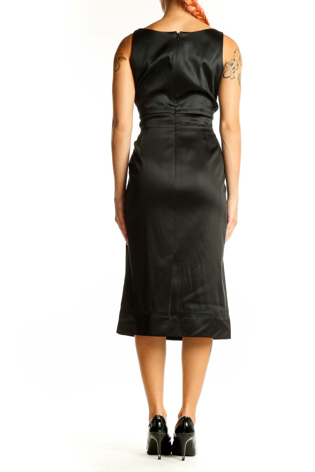 Side view of black satin midi dress showing sleek silhouette