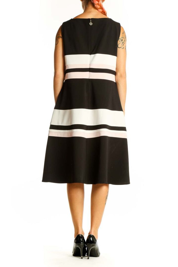 Side view of Tommy Hilfiger black and white striped A-line midi dress