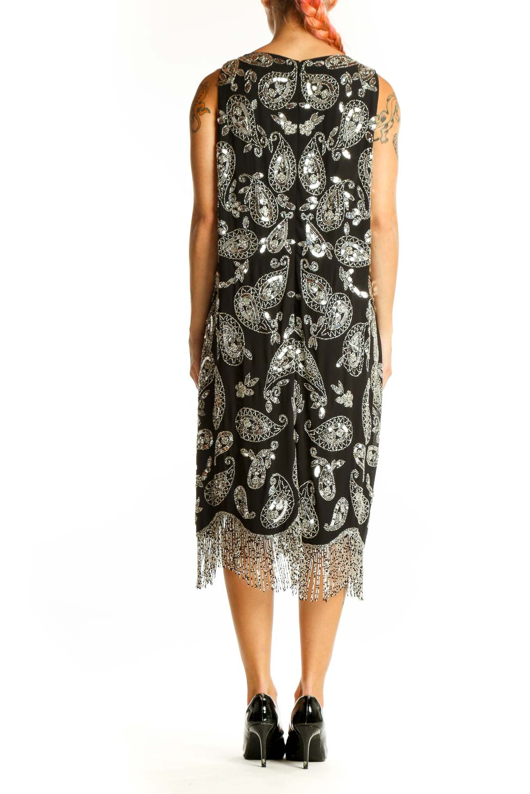Side view of MICHAEL Michael Kors Black Paisley Print Sleeveless Midi Dress showing paisley pattern and fringe detail
