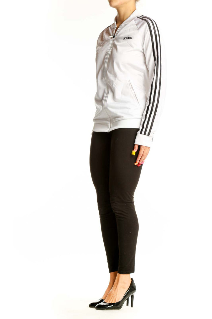 Front view of white Adidas track jacket with black stripes