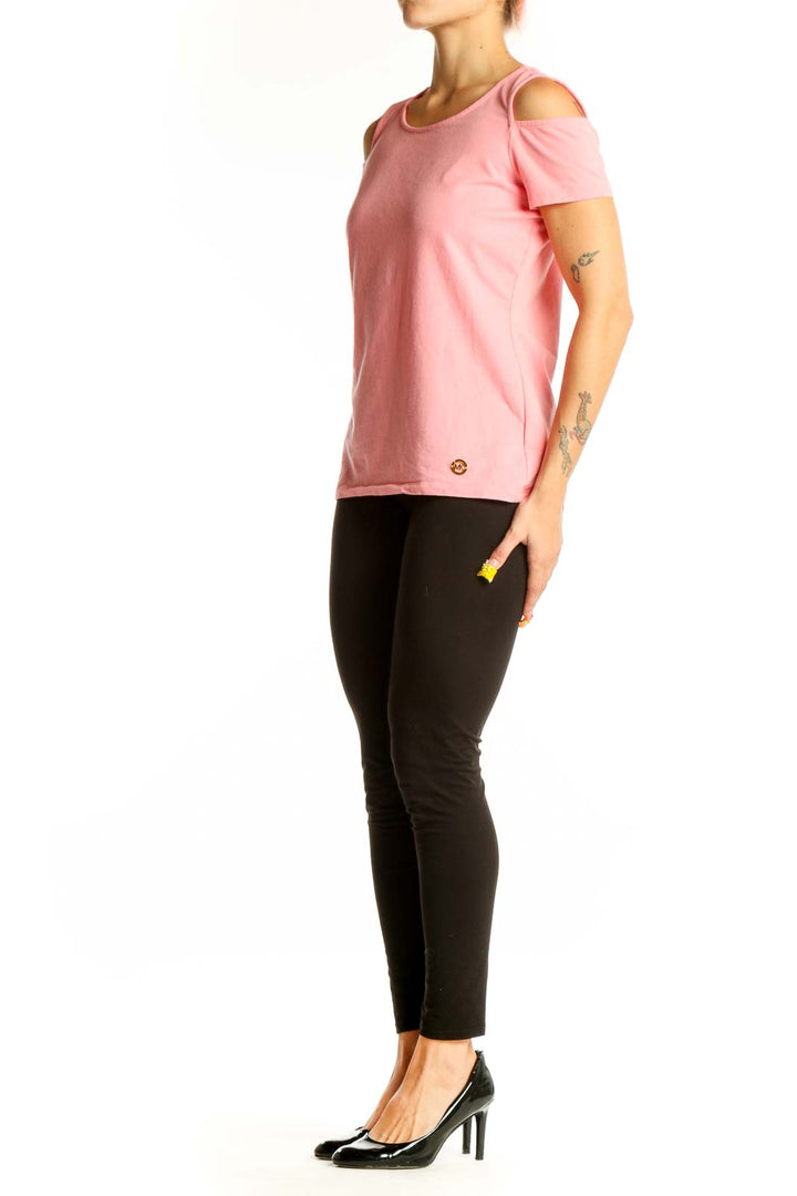 Front view of pink MICHAEL Michael Kors cold shoulder top