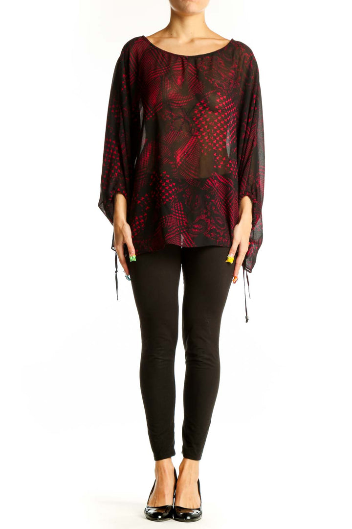 Front view of MICHAEL Michael Kors red and black patterned sheer blouse with batwing sleeves
