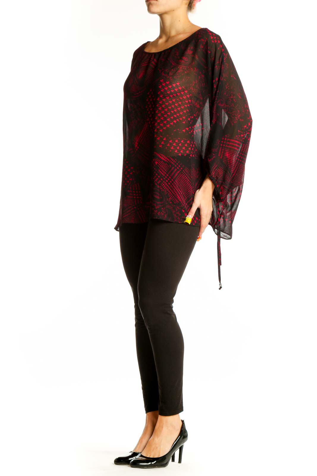 Front view of MICHAEL Michael Kors red and black patterned sheer blouse with batwing sleeves