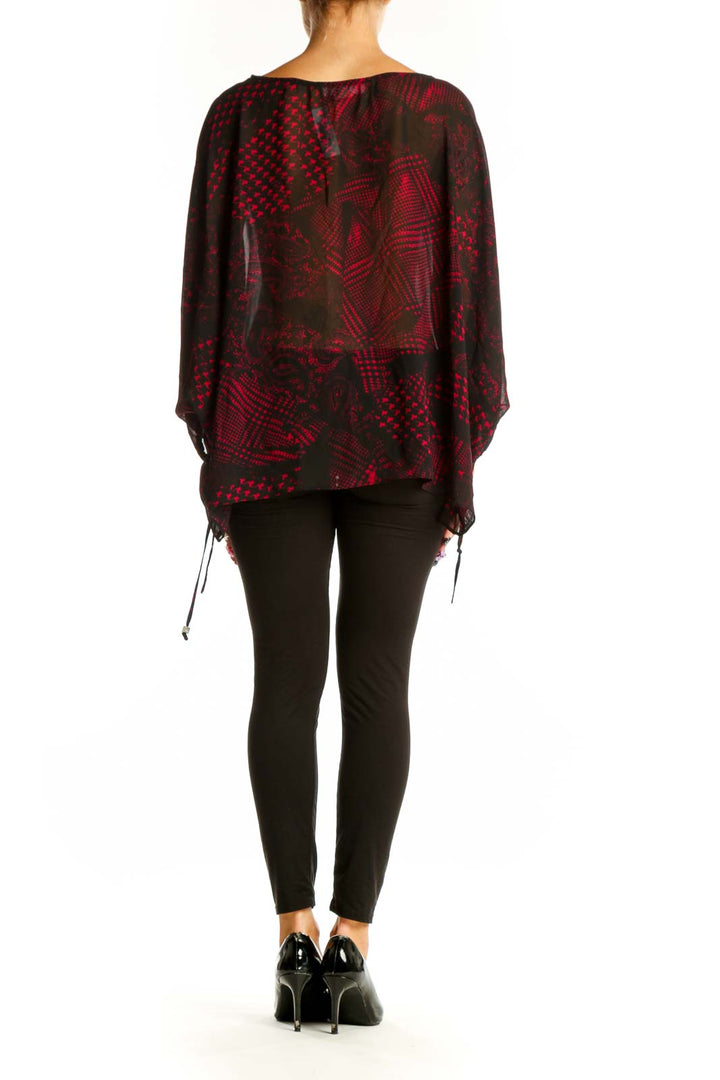 Side view of MICHAEL Michael Kors red and black patterned sheer blouse showing flowy silhouette