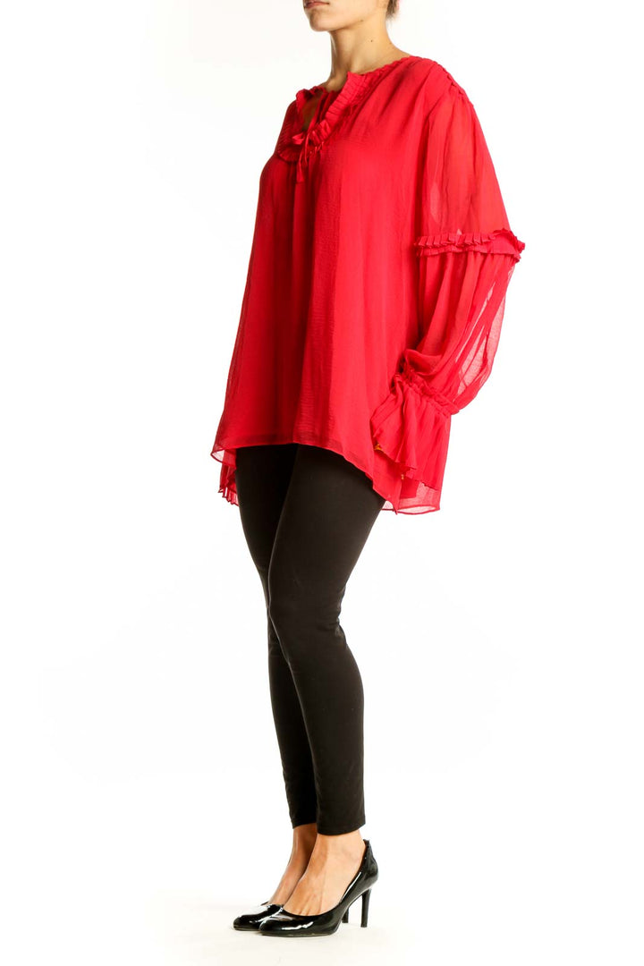 Front view of red flowy Max Studio blouse with ruffle trim and keyhole neckline
