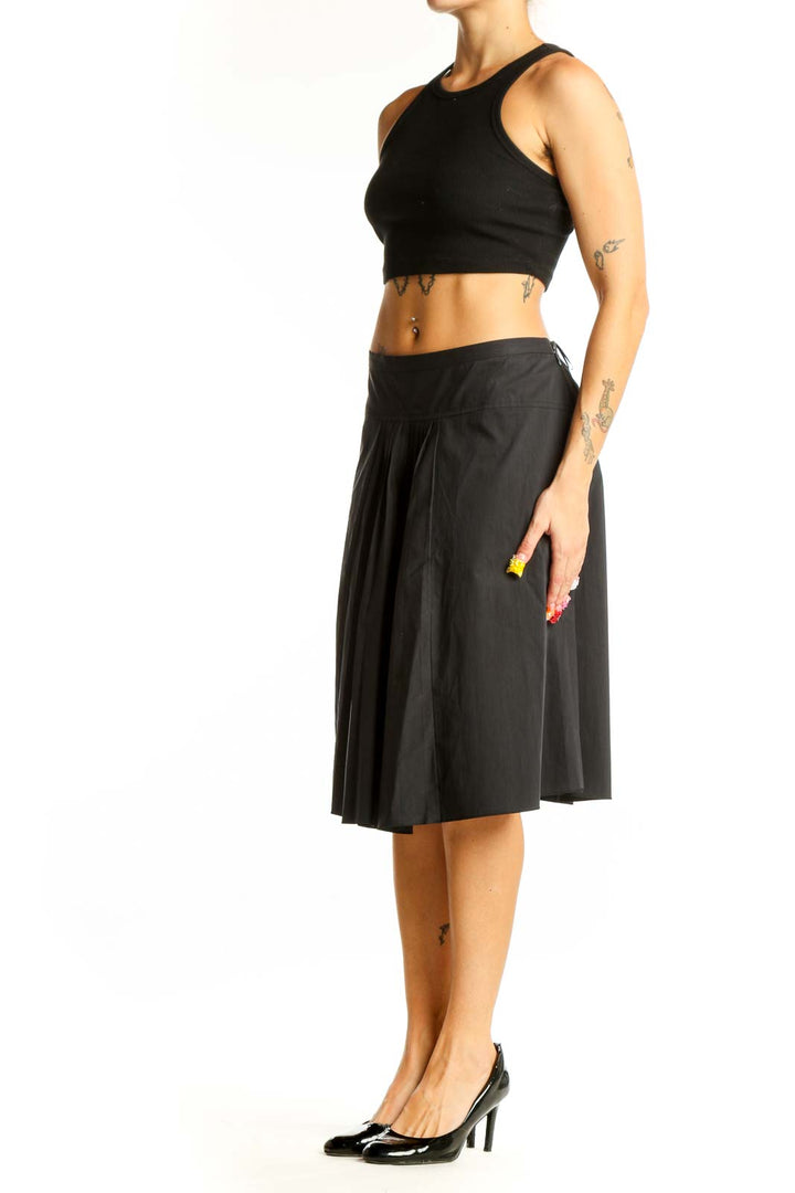 Front view of Moschino Cheap And Chic black pleated midi skirt