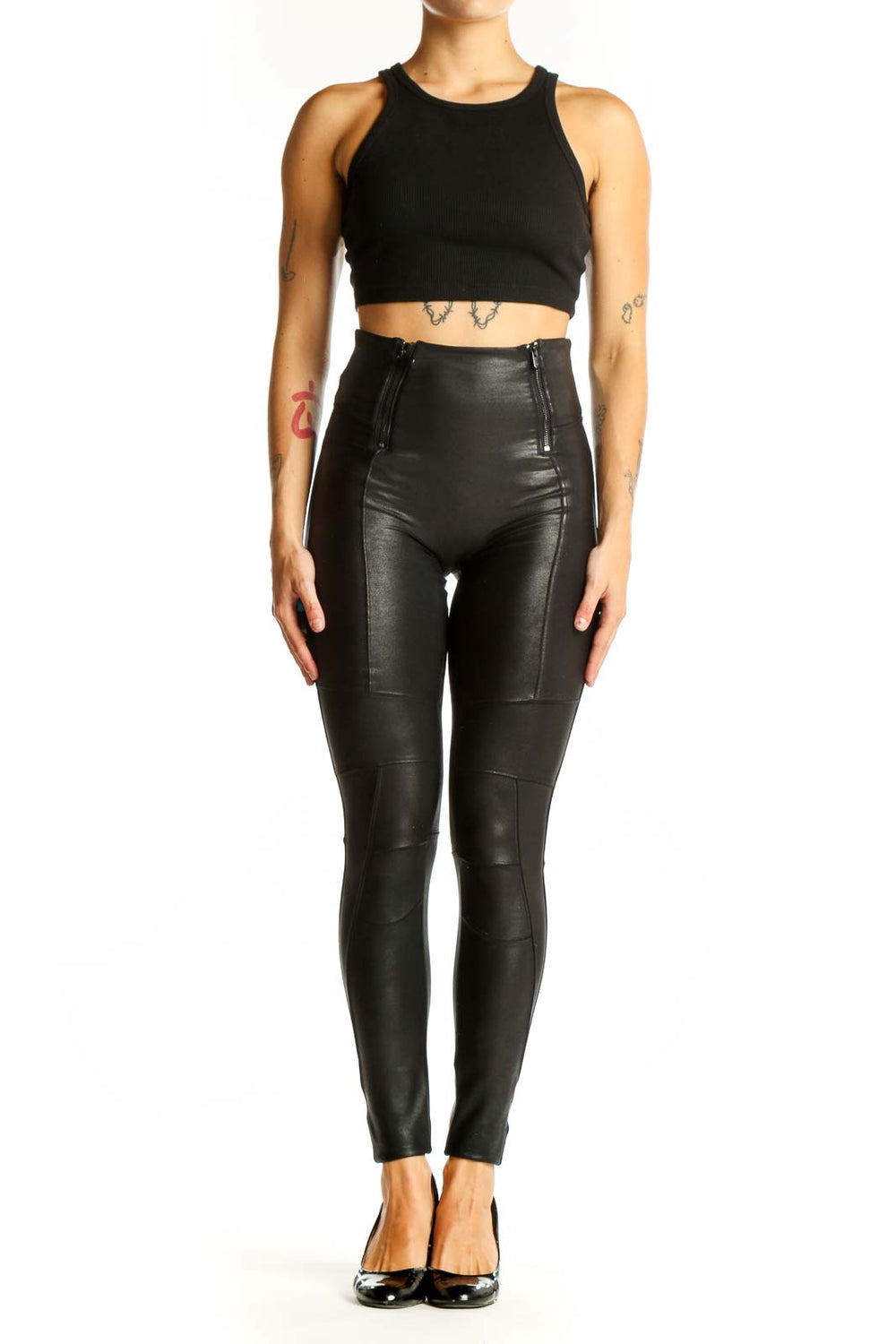 Front view of Spanx black high-waisted faux leather leggings with side zippers