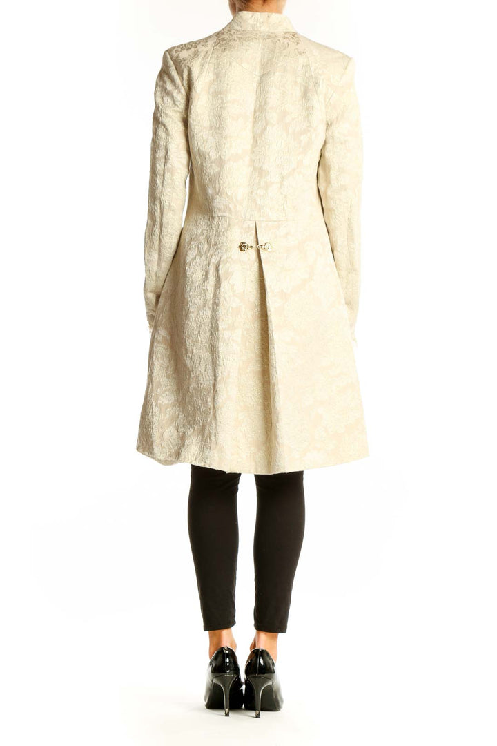 Back view of cream textured Nicole Miller long coat showing full length and fit