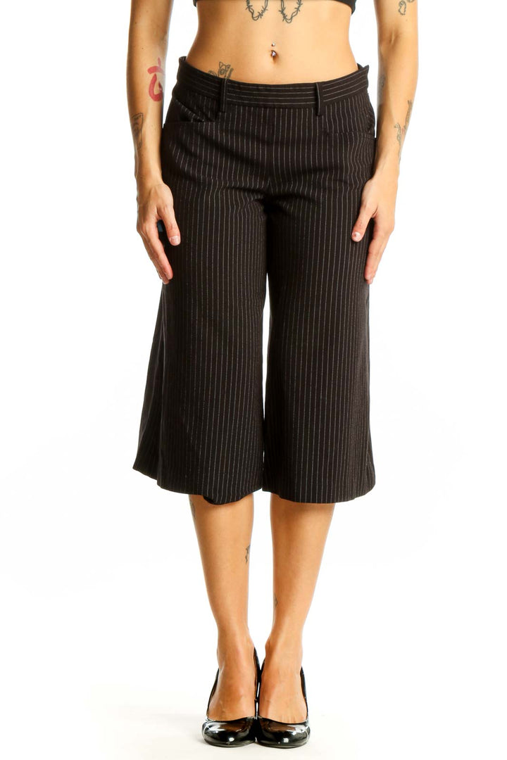 Front view of BCBG MaxAzria black pinstriped cropped wide-leg trousers on model