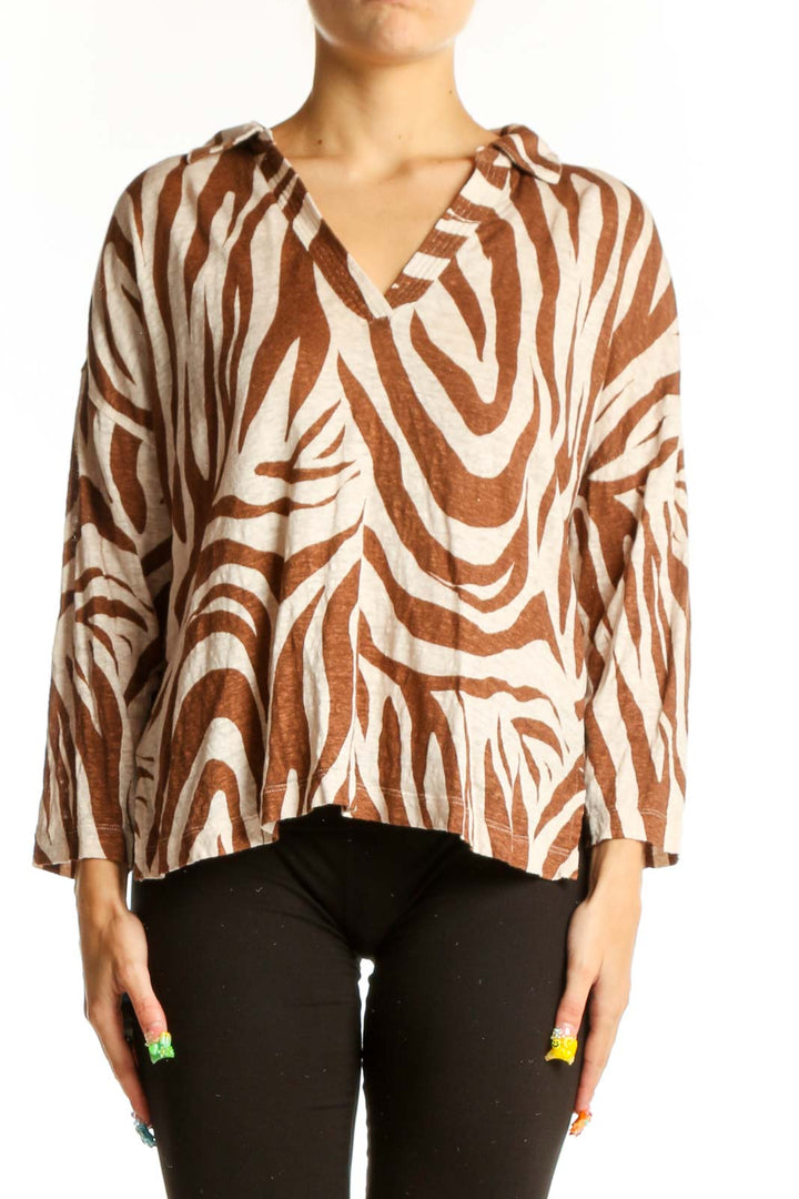 Front view of Tahari brown and cream zebra print linen top with V-neckline