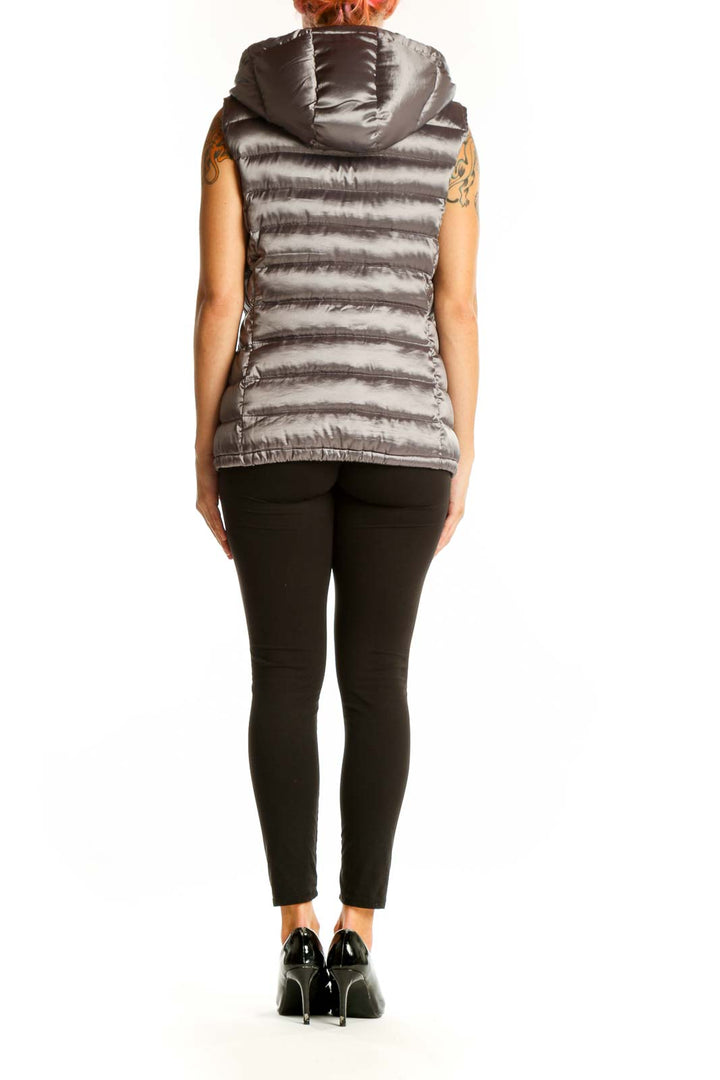 Side view of woman wearing silver Bernardo quilted puffer vest