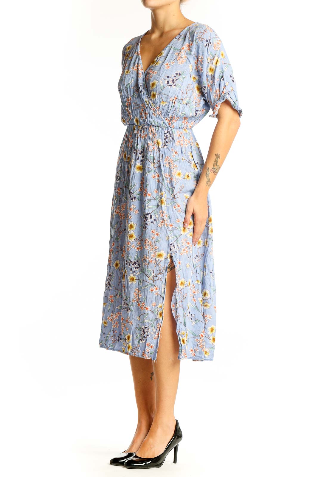 Front view of All in Favor blue floral wrap midi dress with yellow and pink flowers