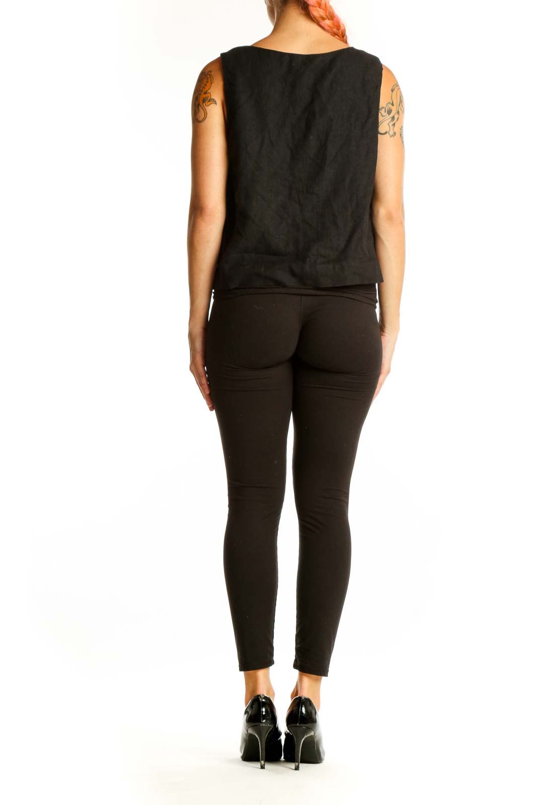 Side view of black linen sleeveless top showing cropped length