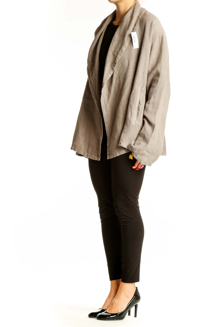 Front view of Bryn Walker beige cotton oversized jacket with shawl collar