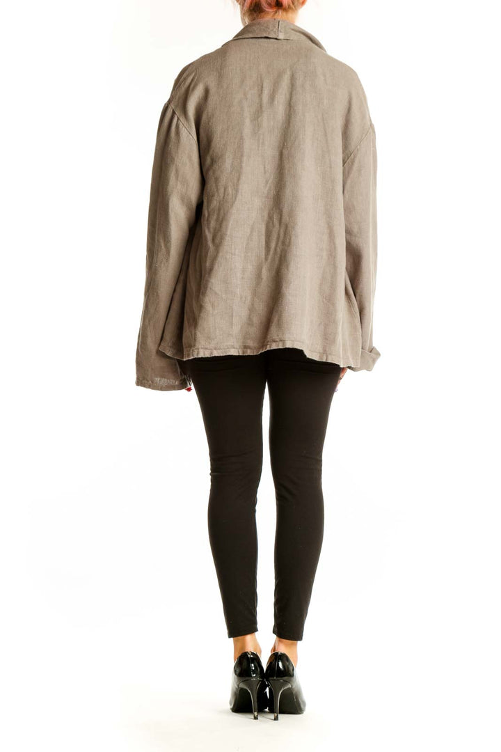 Back view of Bryn Walker beige cotton oversized jacket on model