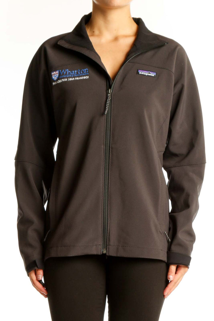 Front view of brown Patagonia softshell jacket with Wharton logo