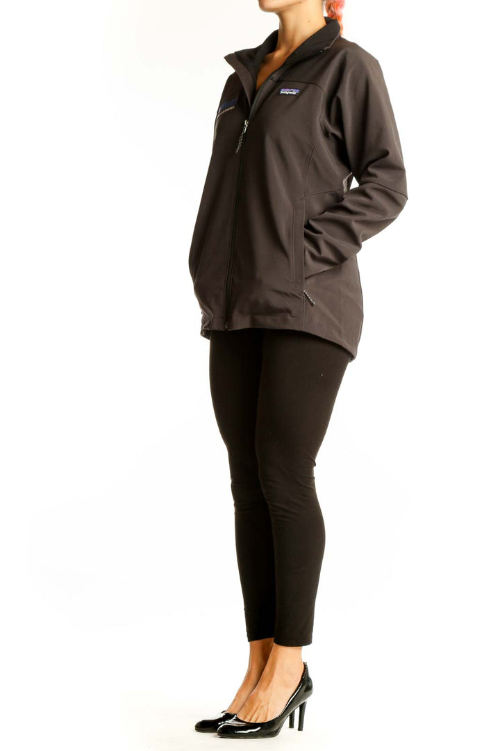 Front view of brown Patagonia softshell jacket with Wharton logo