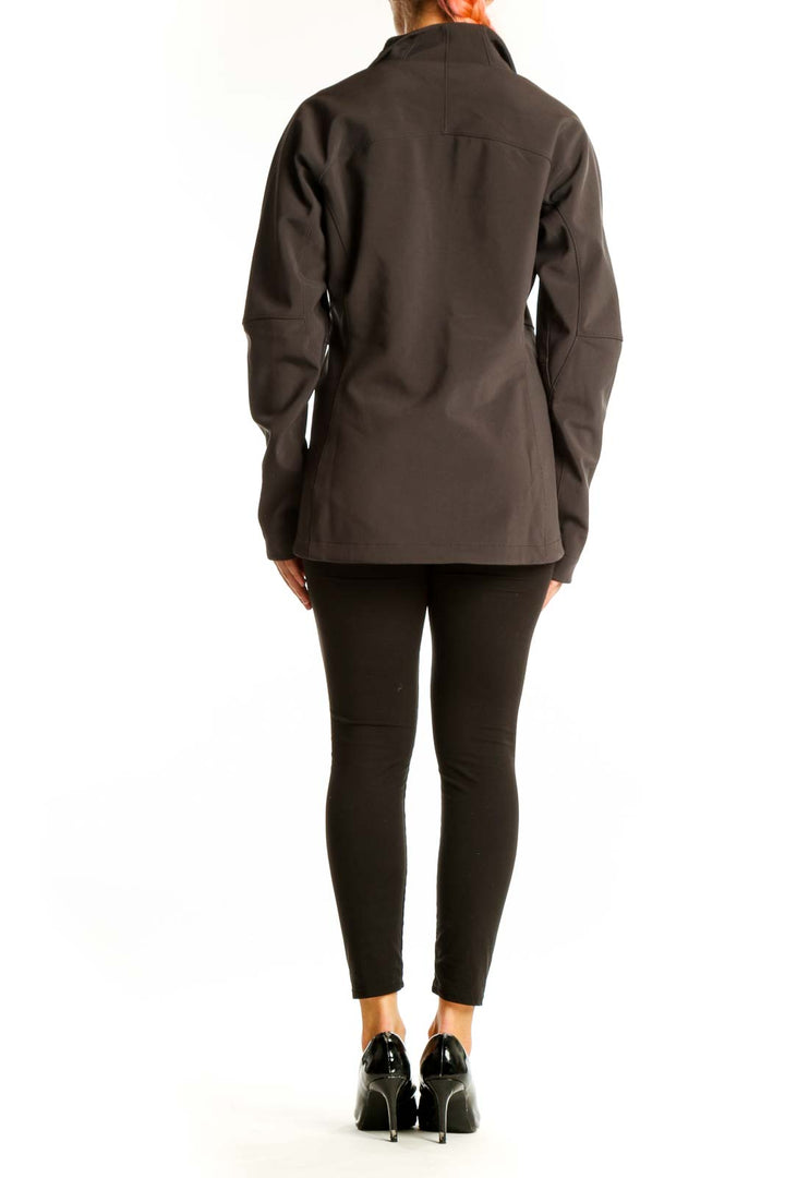 Side view of brown Patagonia softshell jacket on model