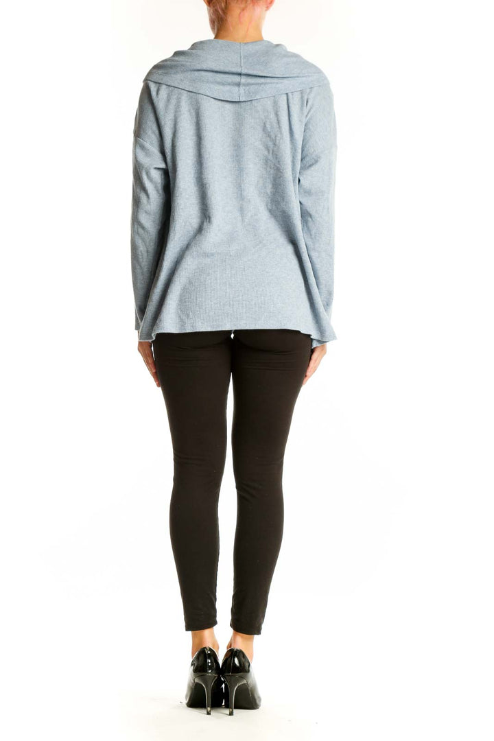 Side view of MICHAEL Michael Kors light blue cowl neck ribbed sweater on model