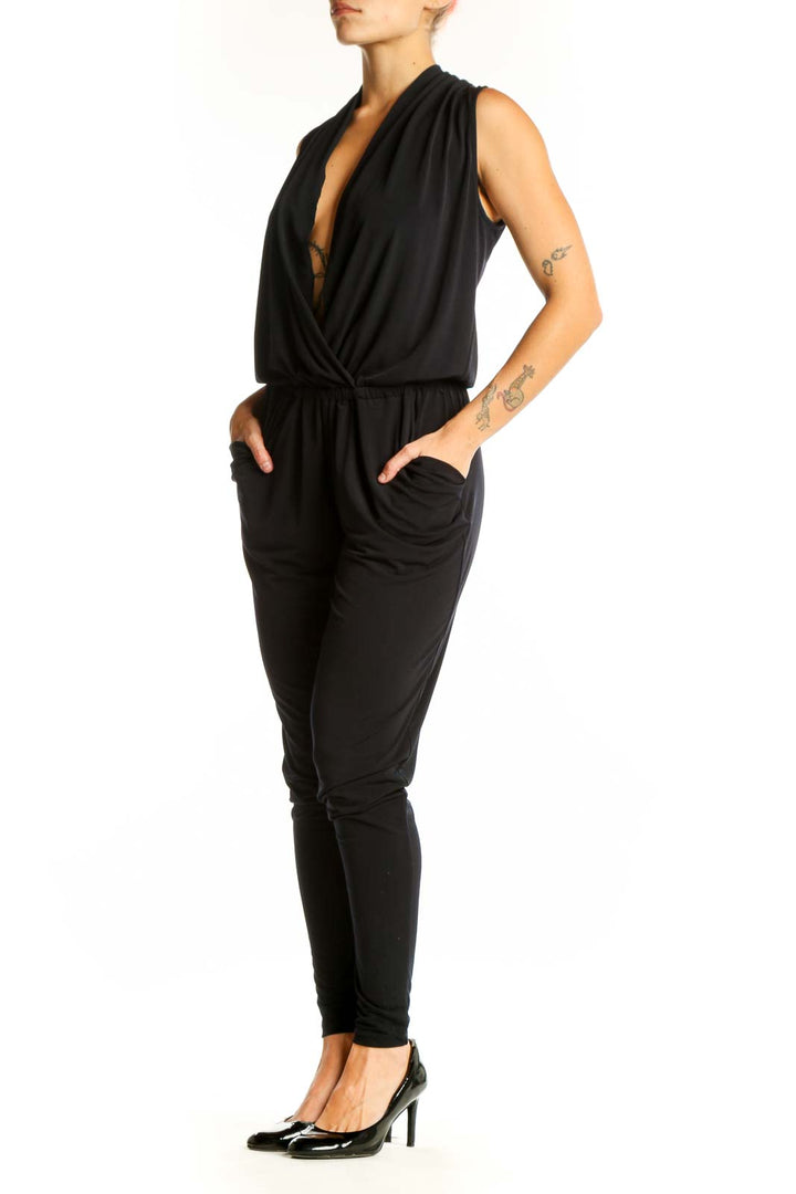 Front view of black MICHAEL Michael Kors wrap jumpsuit with plunging neckline