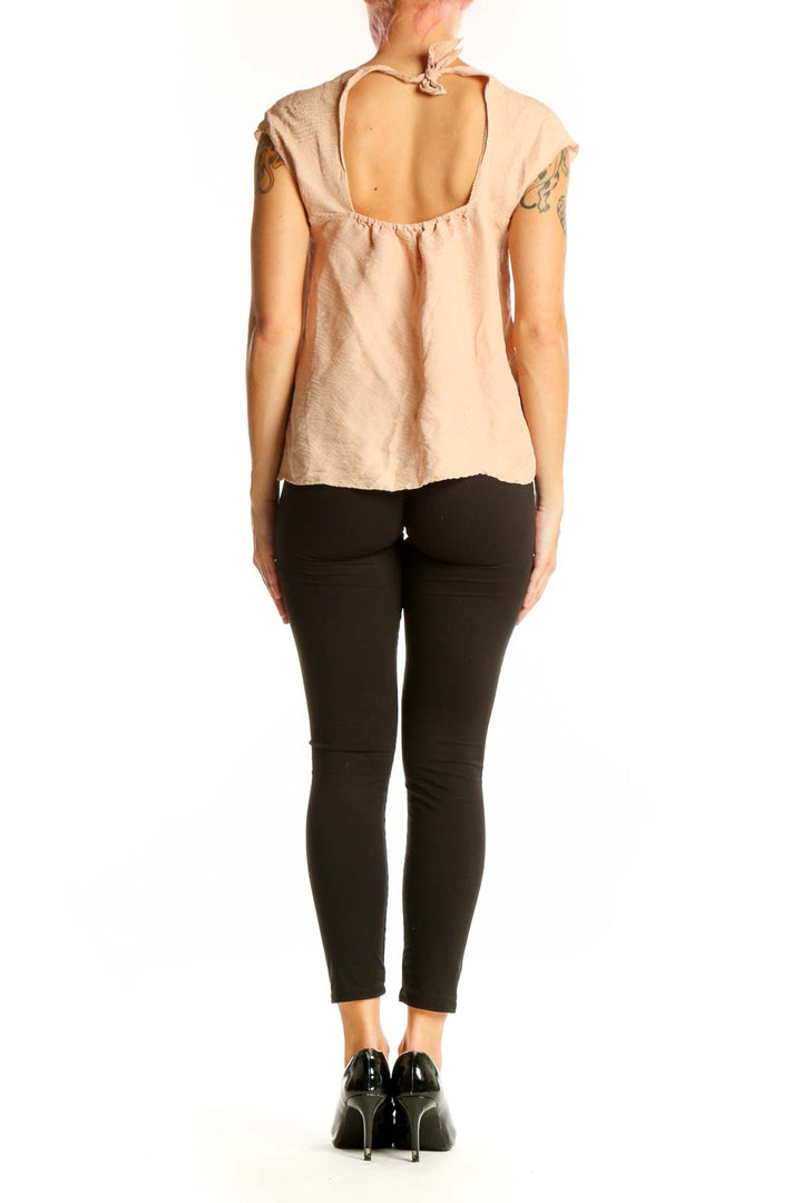 Side view of Rebecca Taylor blush cap sleeve top on model