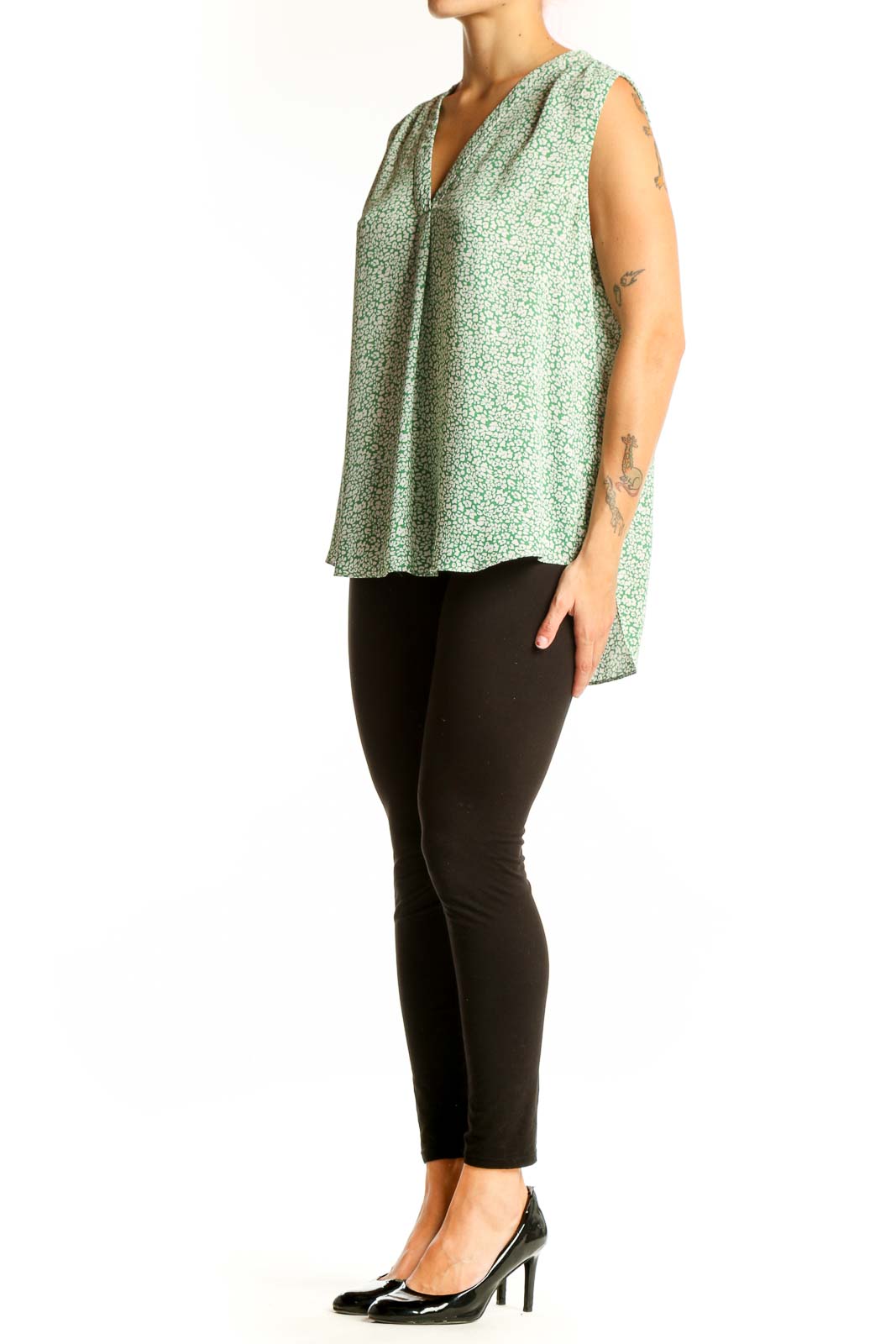 Front view of Vince Camuto green floral sleeveless blouse with V-neckline