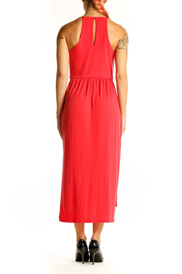 Side view of red BCBGeneration midi dress showing draped silhouette