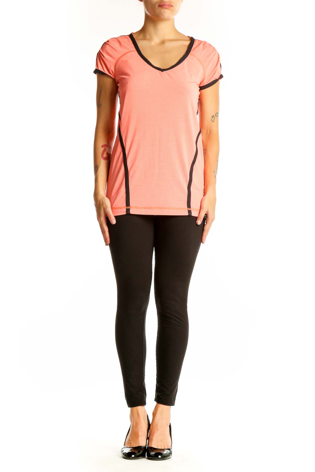 Front view of coral Lululemon V-neck performance top with black trim