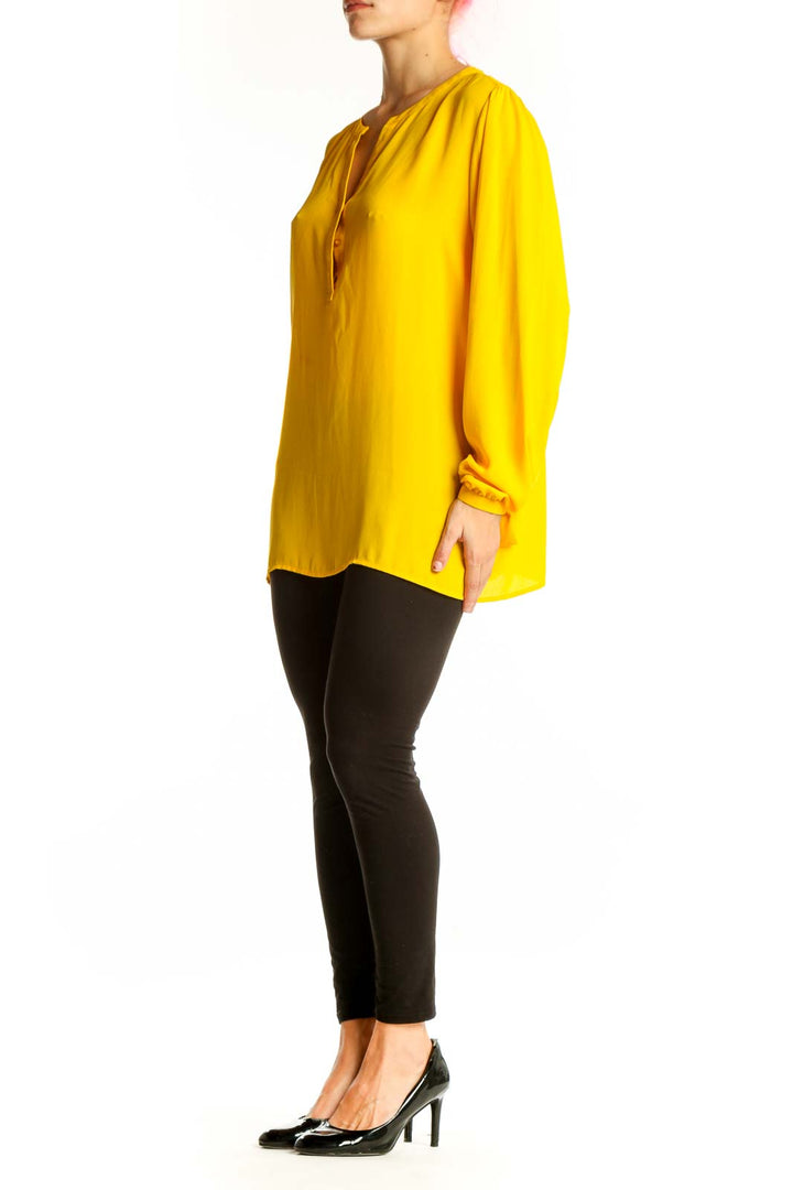 Front view of yellow V-neck long sleeve blouse by Violet & Claire