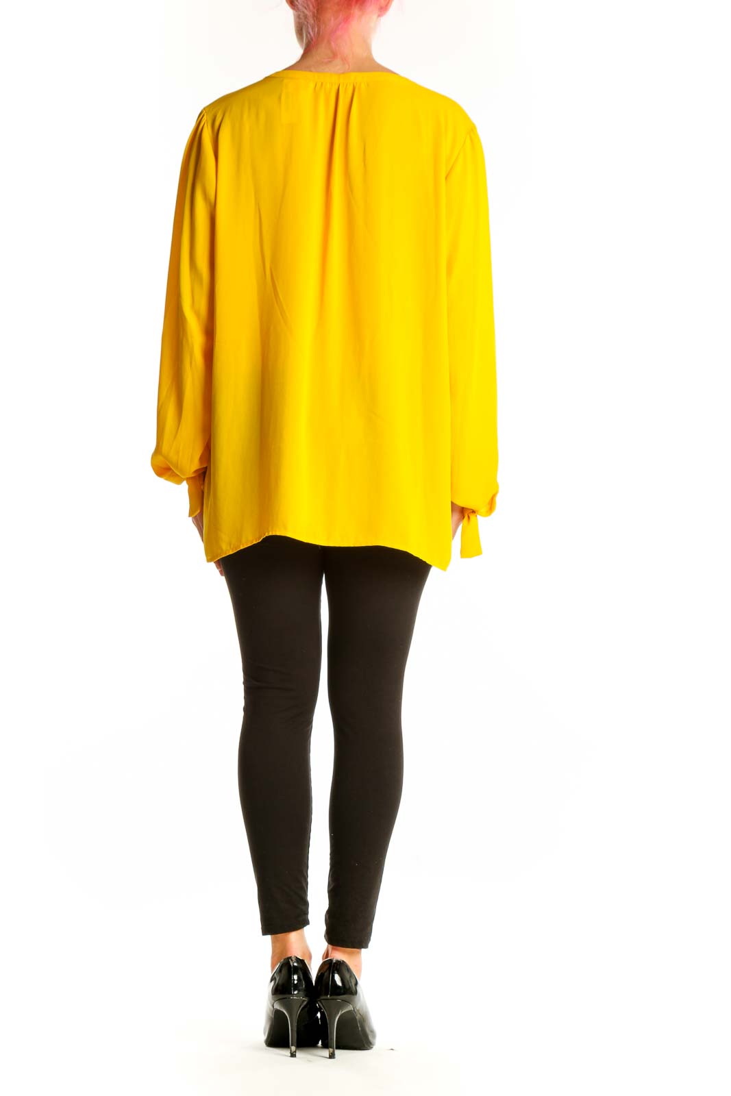 Side view of yellow V-neck long sleeve blouse by Violet & Claire on model