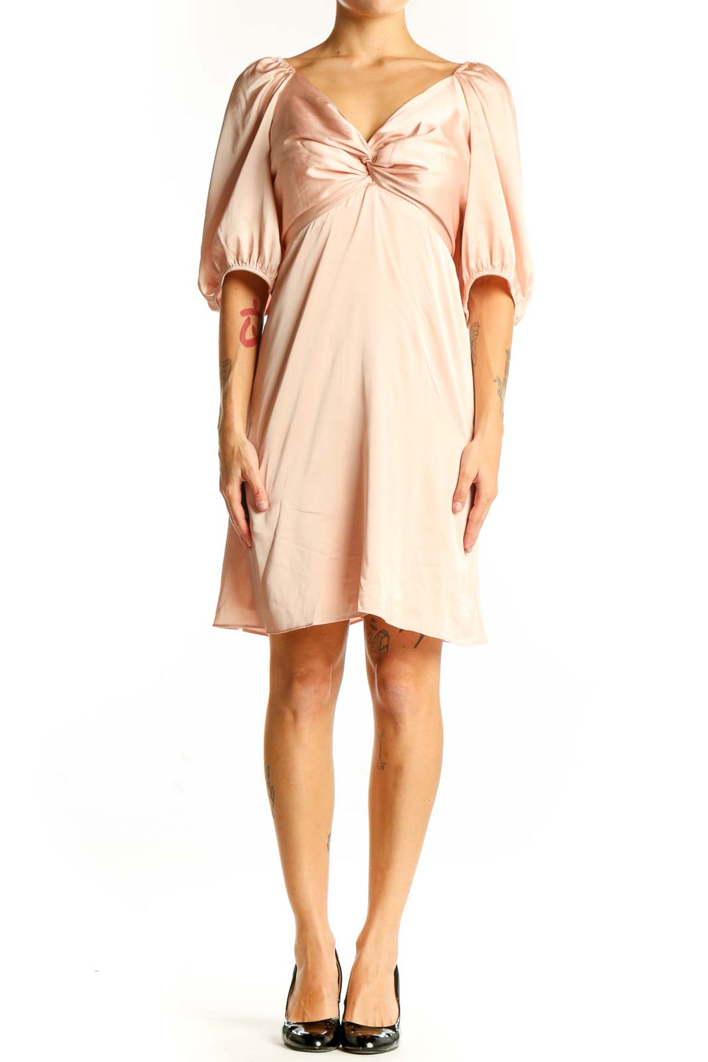 Front view of blush Express dress with twist-front detail and puff sleeves