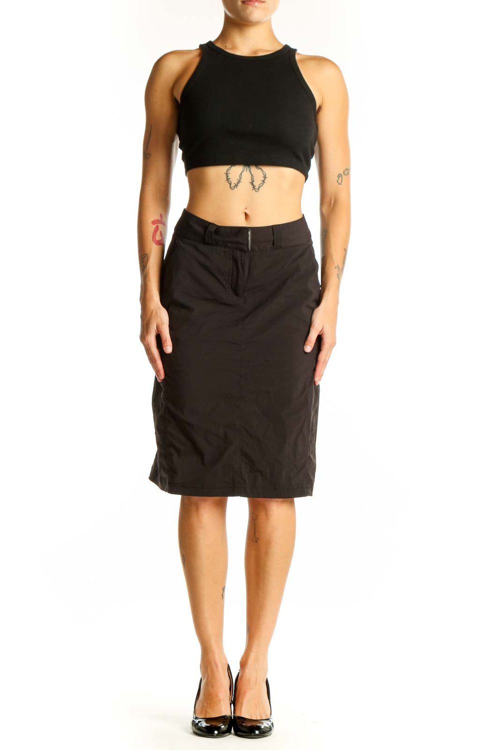 Front view of Exofficio black knee-length skirt on model