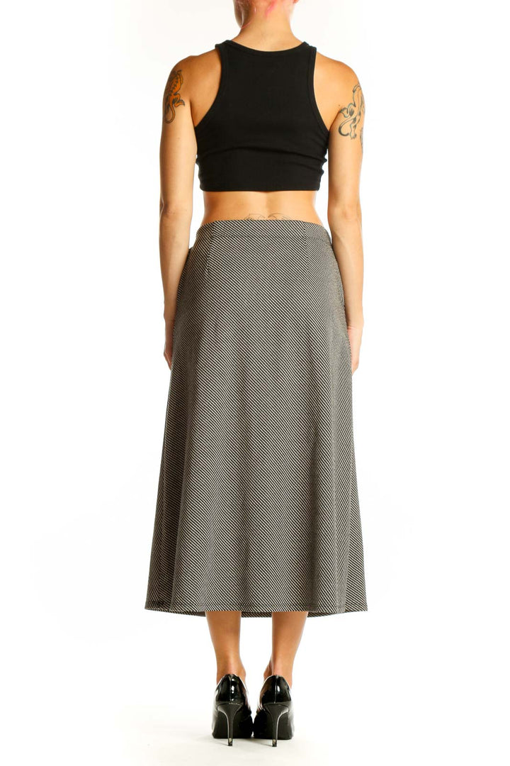 Side view of Max Studio gray diagonal striped midi skirt on model