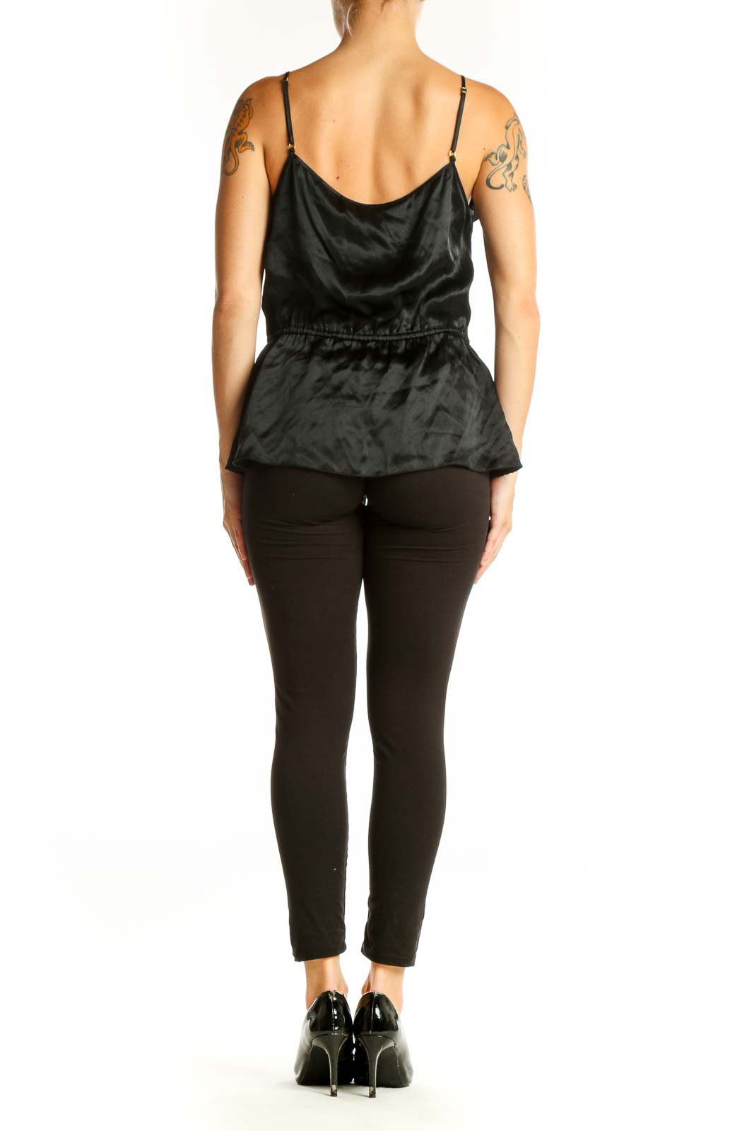 Side view of Trina Turk black silk camisole top showing peplum style and drawstring waist
