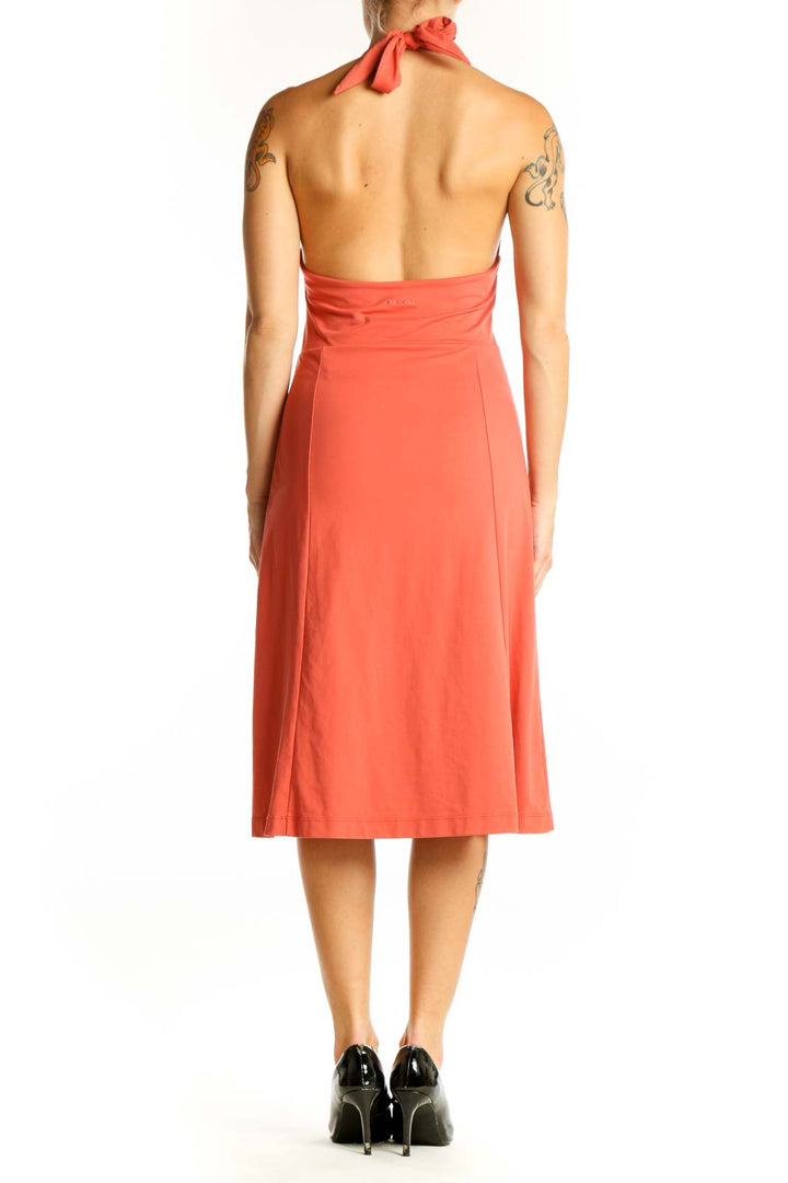 Side view of coral Patagonia halter neck A-line dress