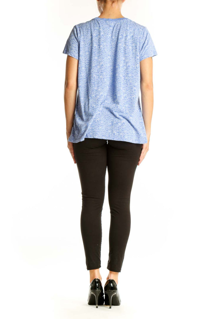 Side view of blue Marine Layer top showing relaxed fit