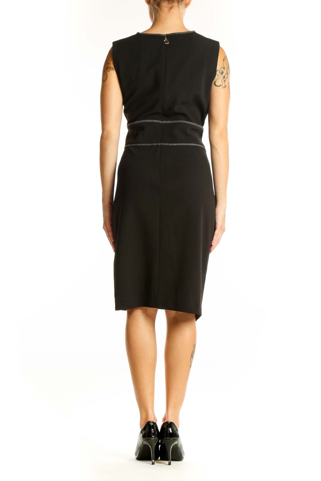Side view of Tommy Hilfiger black asymmetric sheath dress showing wrap-like effect