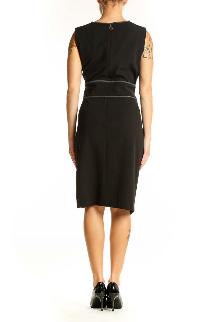 Side view of Tommy Hilfiger black asymmetric sheath dress showing wrap-like effect