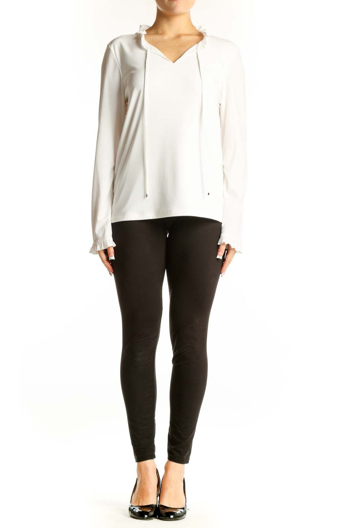 Front view of white Tommy Hilfiger V-neck top with ruffle details