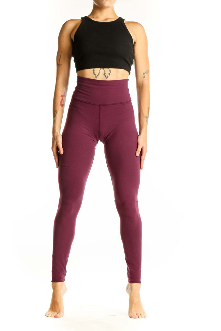 Front view of burgundy Lululemon high-waisted athletic leggings