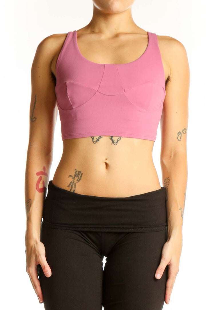 Front view of pink Lululemon racerback crop top