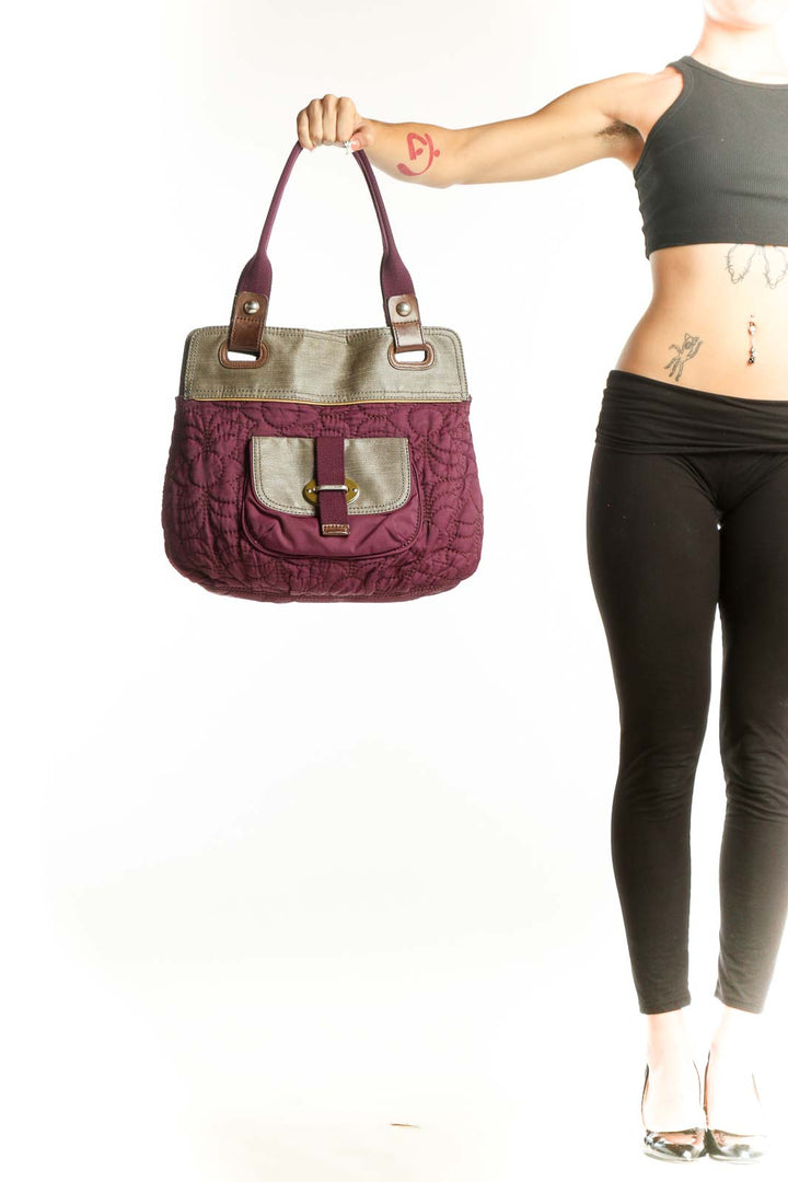 Front view of purple quilted Fossil messenger bag with beige trim