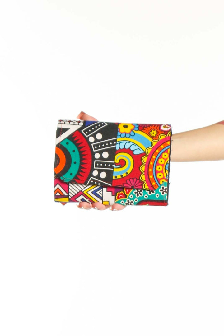 Front view of multicolor patterned clutch with artistic design